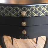 Bedside or nightstand painted black with patterns