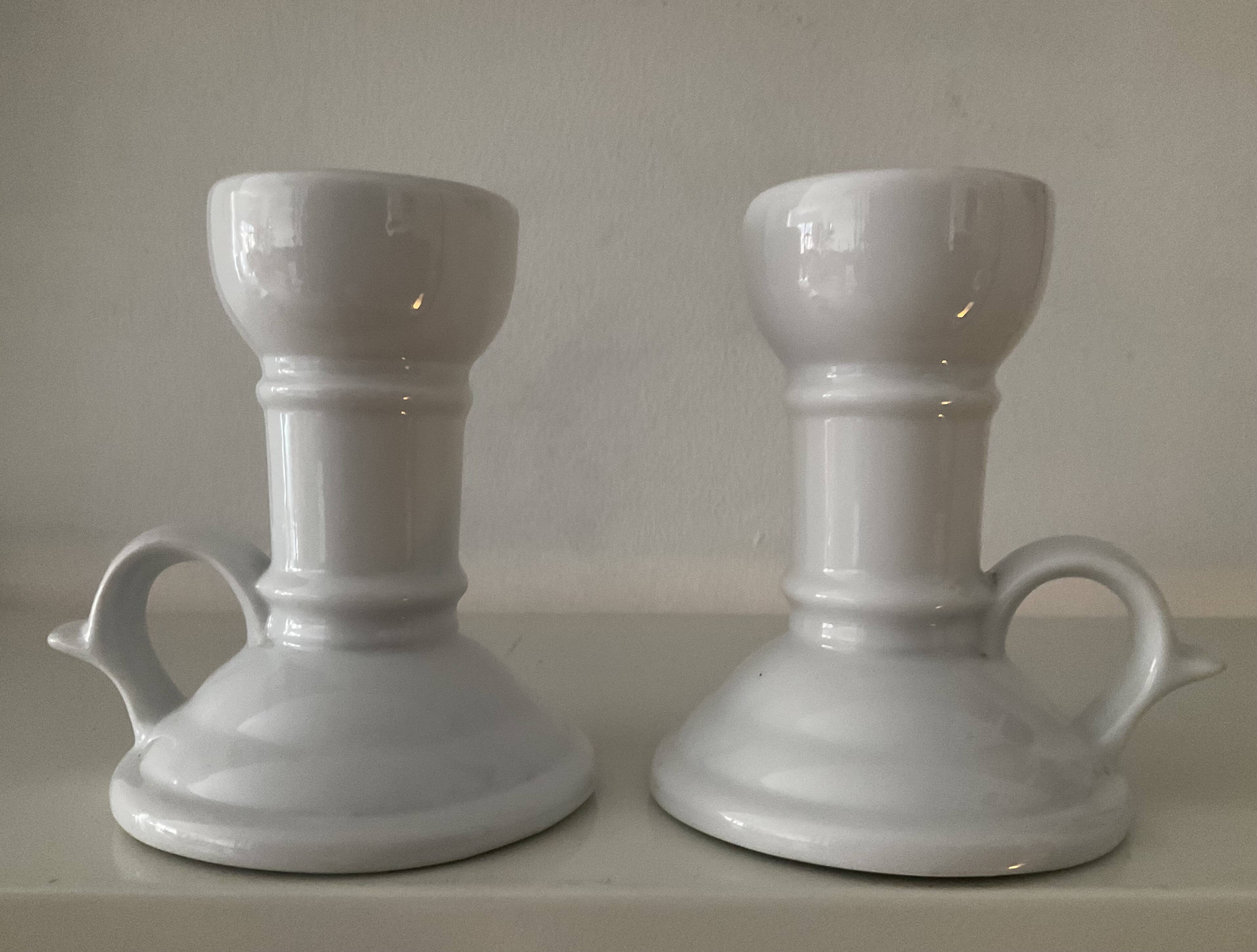 Pair of vintage cellar rat porcelain candlesticks