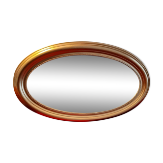 Miroir ovale doré biseauté, 95x59 cm
