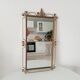 Vintage Hollywood Regency mirror from the 1950s.