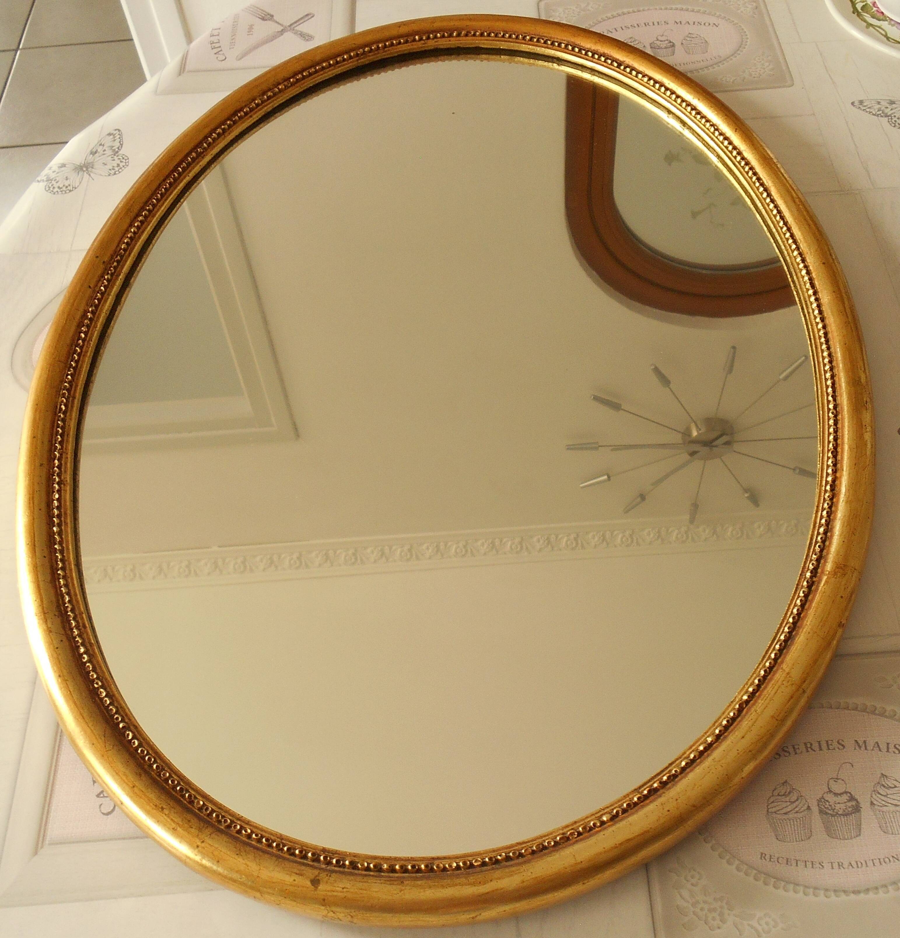 Oval gold mirror