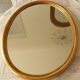 Oval gold mirror