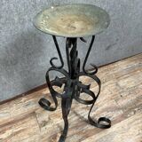 Wrought iron candlestick on four-legged base circa 1900-1930
