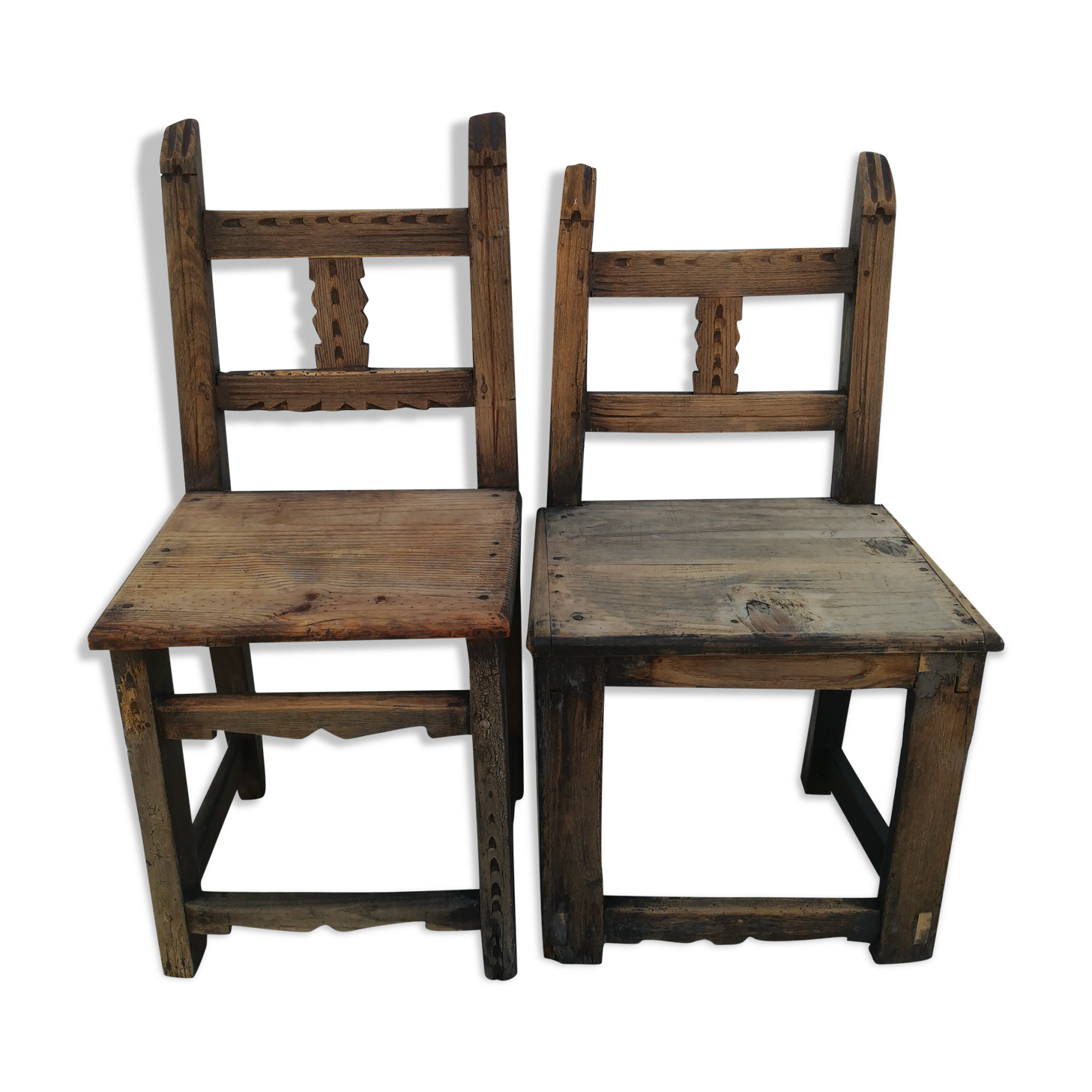 Pair of ethnic crude wooden chairs