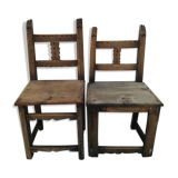 Pair of ethnic crude wooden chairs