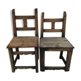 Pair of ethnic crude wooden chairs