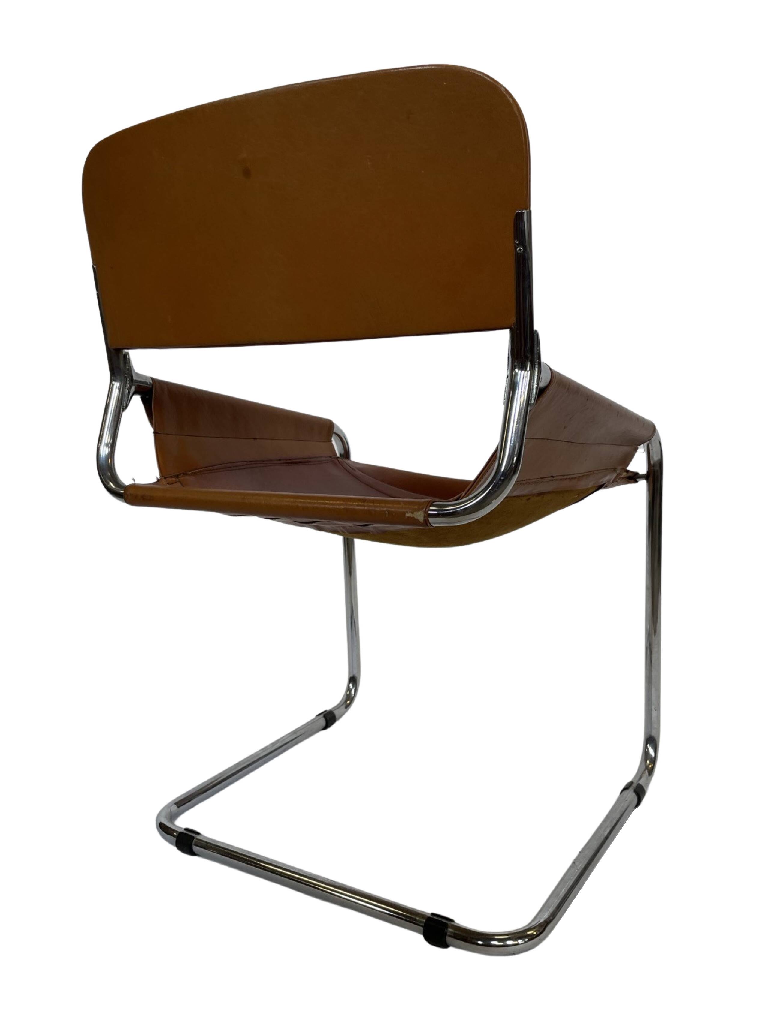 vintage dining room chair in cognac leather and chrome 1970s Italy