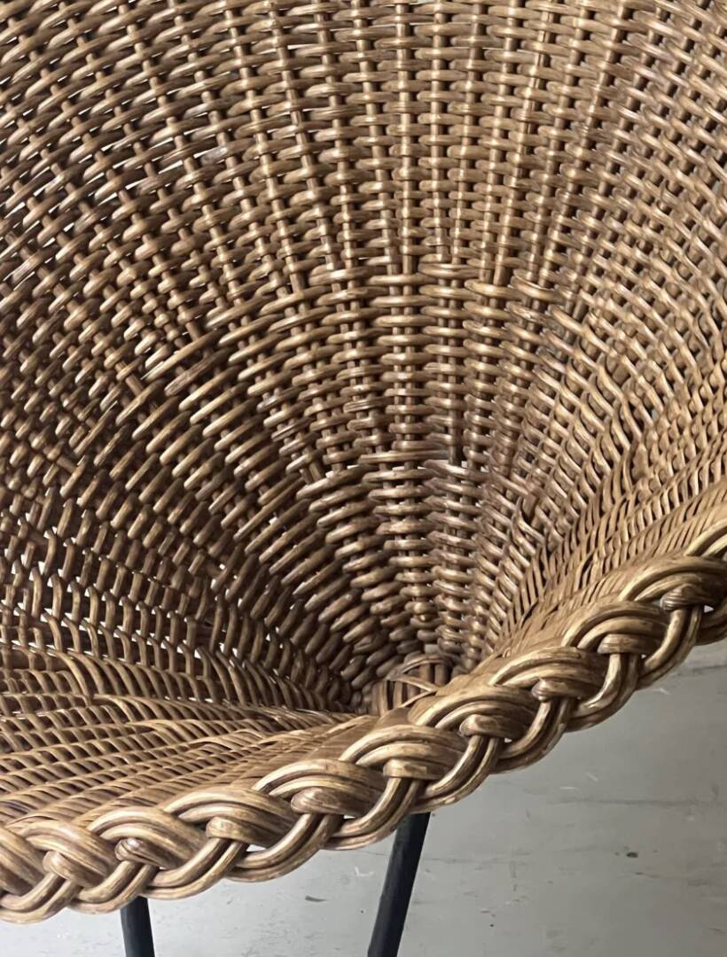 Italian basket chair in rattan and black metal, 1950s design.
