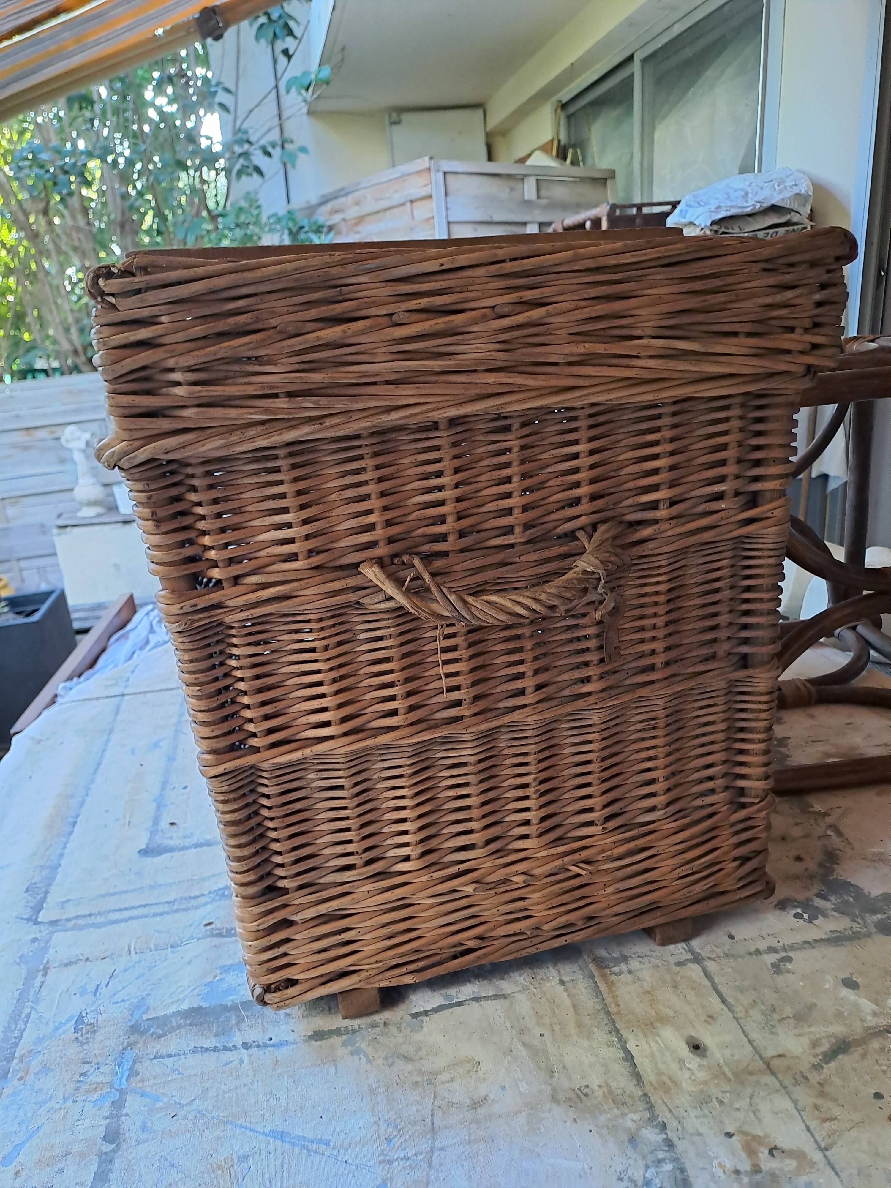 Wicker travel trunk XIX with metal clasps and handles.