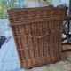 Wicker travel trunk XIX with metal clasps and handles.
