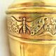 Vase in brass worked with flowers and butterflies around 1930