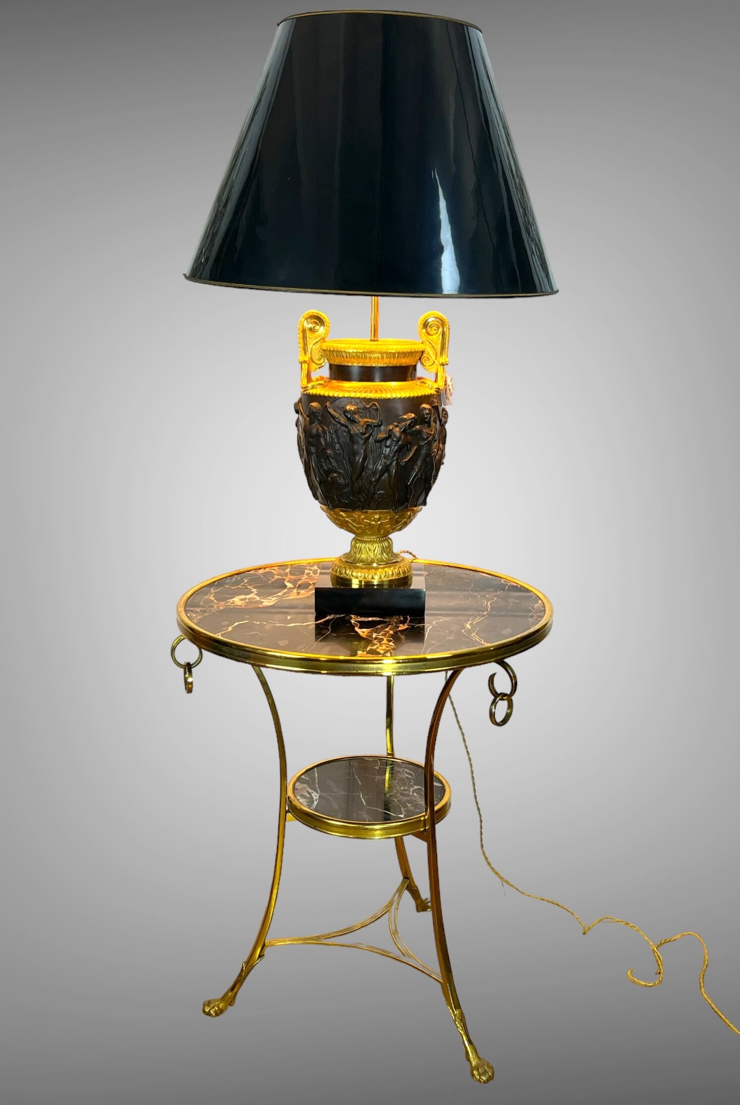 Gueridon tripod with gilded bronze frame covered with portor marble