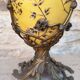 Large covered box in yellow earthenware with polychrome enamels and brass from the 20th century.