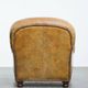 Charming and comfortable vintage armchair in grained cowhide leather with character