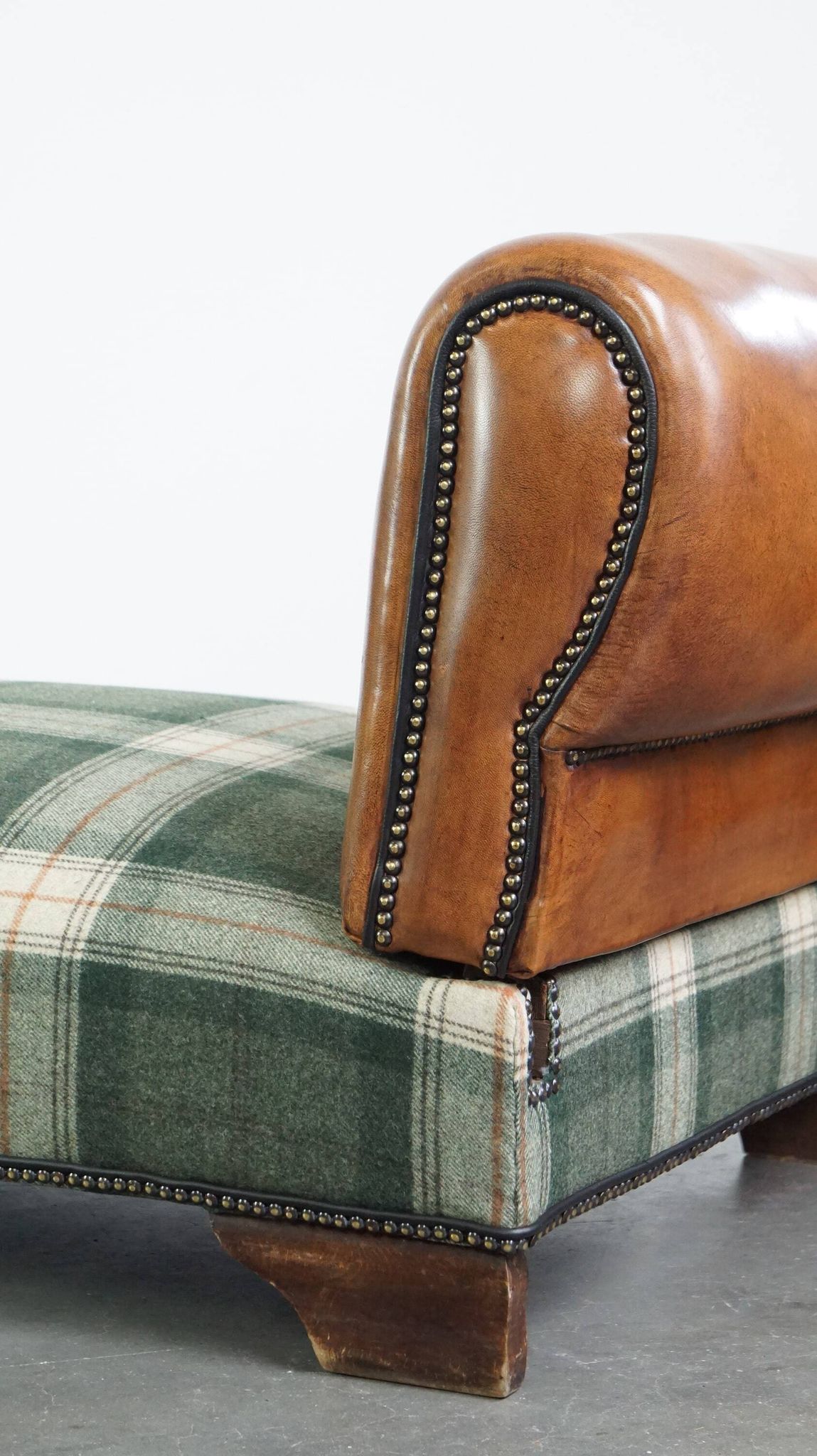 Antique daybed reupholstered with sheepskin and Scottish tartan wool