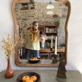 Art nouveau mirror, curved wooden frame and chiseled glass