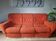 A lot of orange seventies sofas and armchairs.