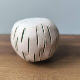 Small round ceramic ball vase with dried flower