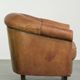 Aged sheepskin clubchair with beautiful vintage patina and comfortable seat