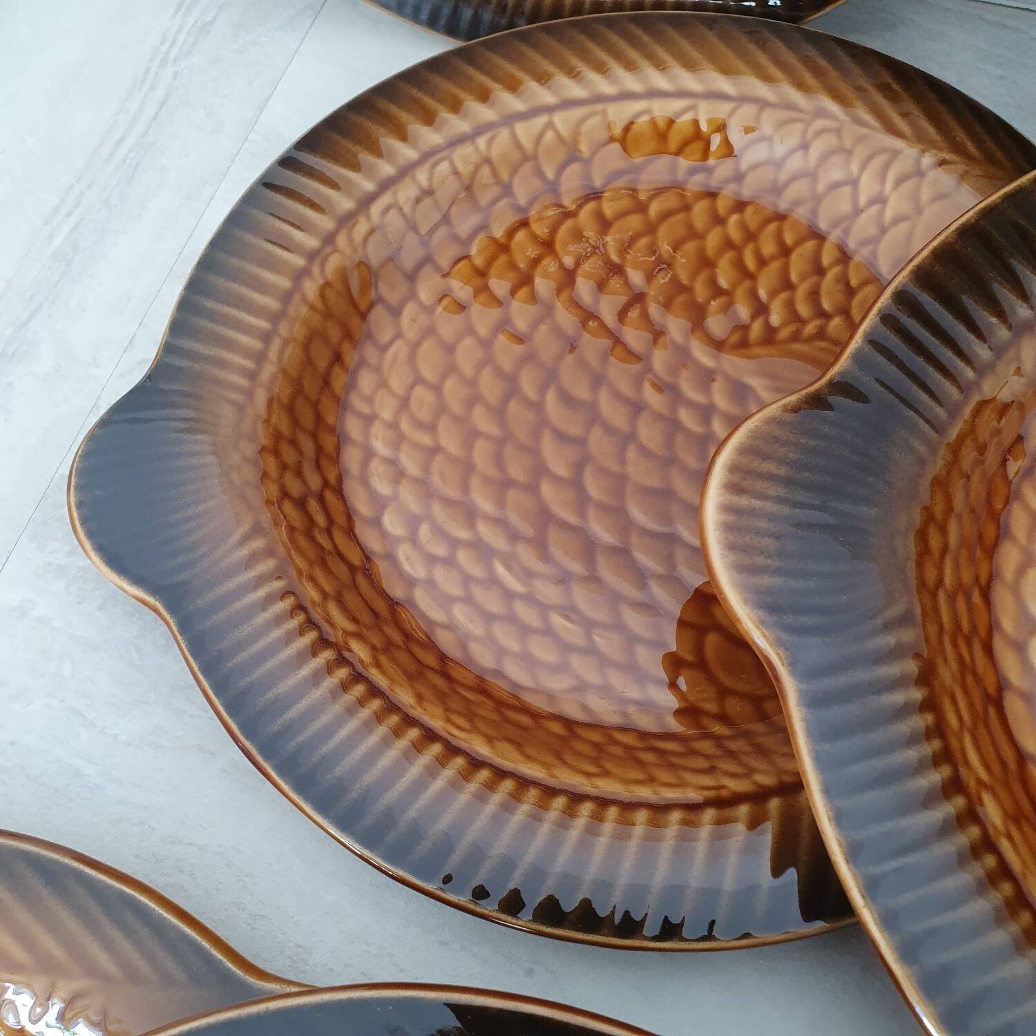 Sarreguemines / 11 earthenware fish-shaped plates