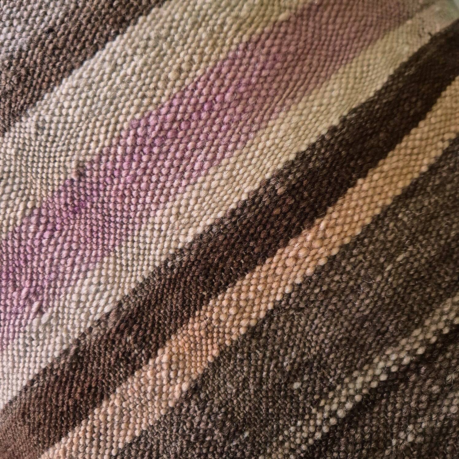 Cushion cover in an old Berber blanket.