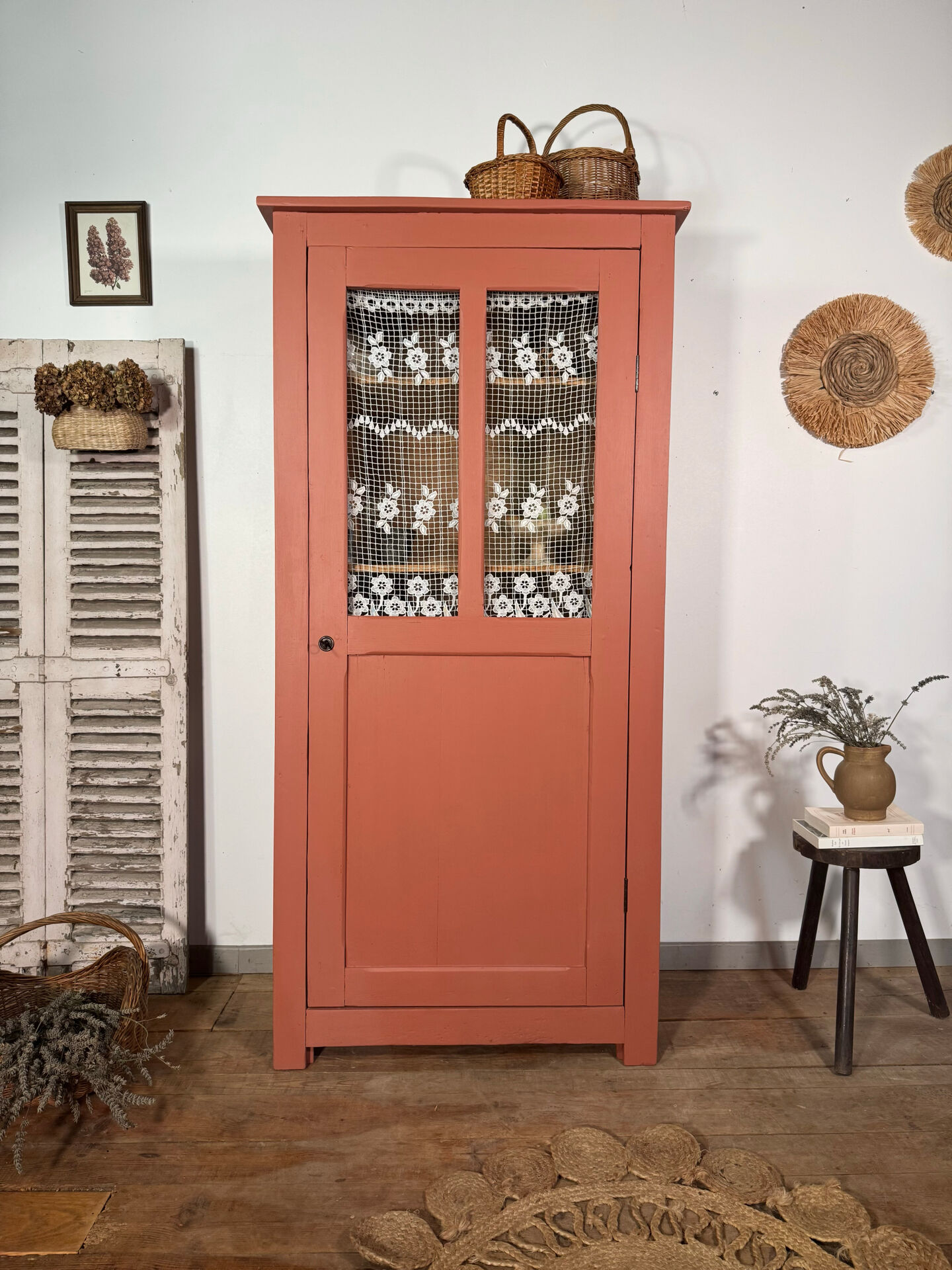 Antique glass-fronted terracotta cupboard