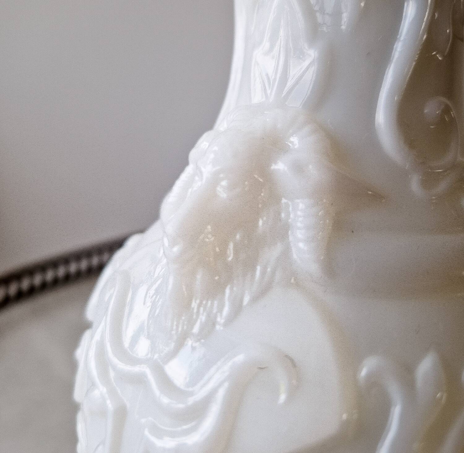 White opaline vase decorated with arabesques and ram's heads