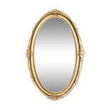 Oval mirror in a golden frame