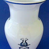 White-blue earthenware vase with stylized plant decoration