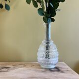 Blown glass decanter and relief decoration