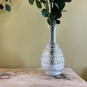 Blown glass decanter and relief decoration