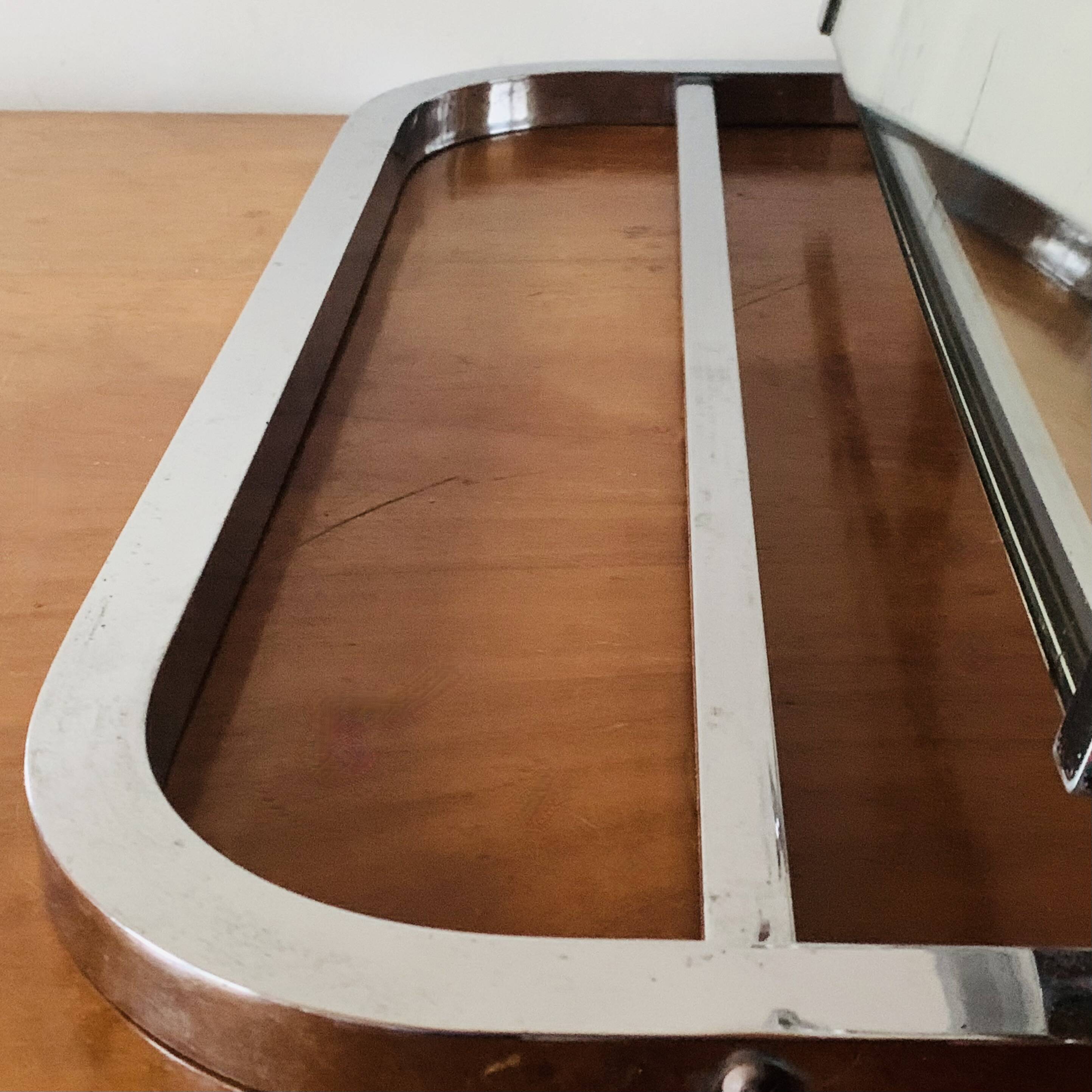 Vintage wall-mounted coat rack in chrome metal with integrated mirror and hat rack