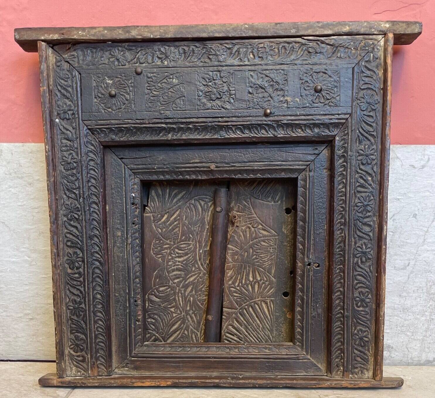 Old Indian window with carved decoration of flowers and foliage 19th century