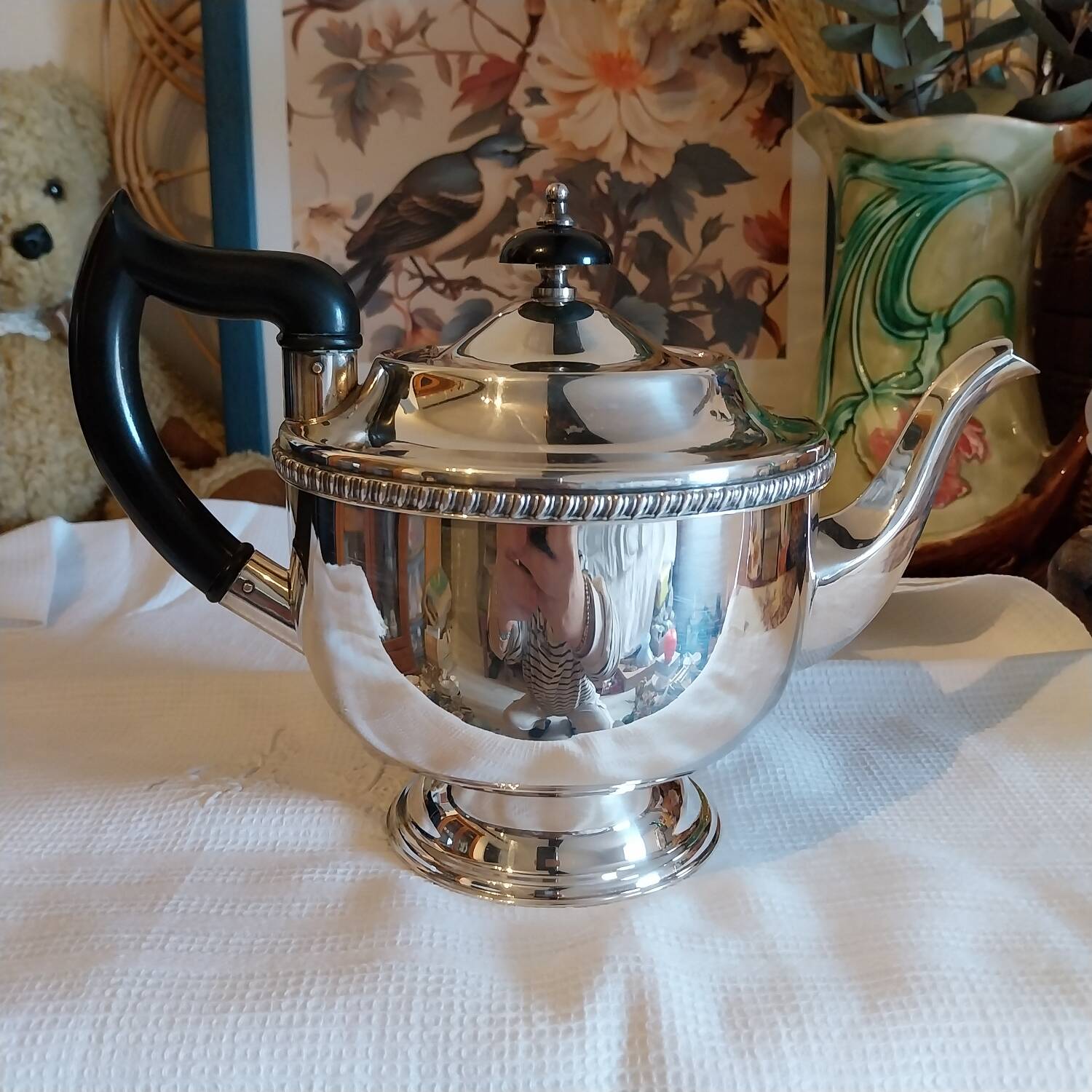 Old English teapot in silver-plated metal and Bakelite.