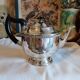 Old English teapot in silver-plated metal and Bakelite.