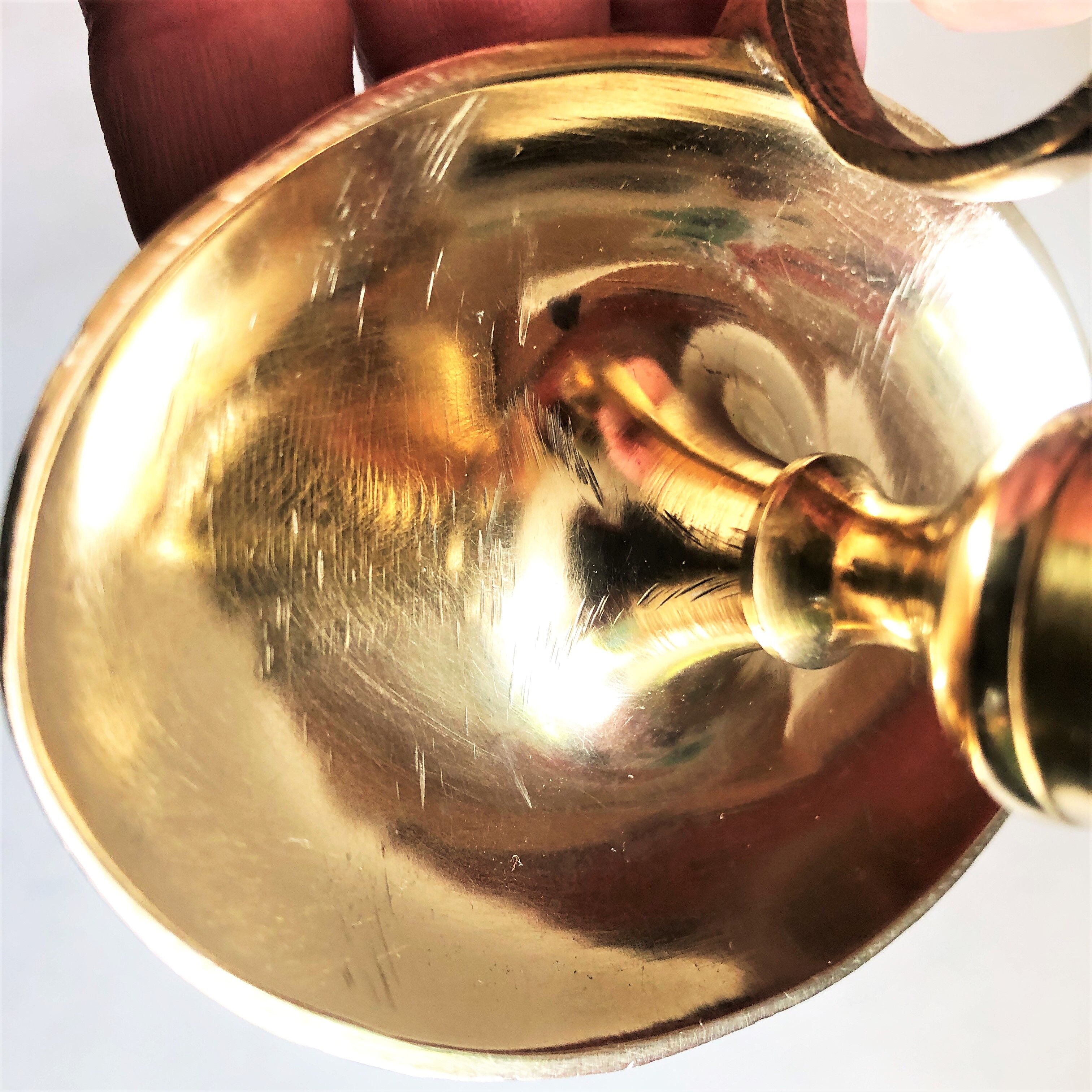 Brass oval hand candle holder