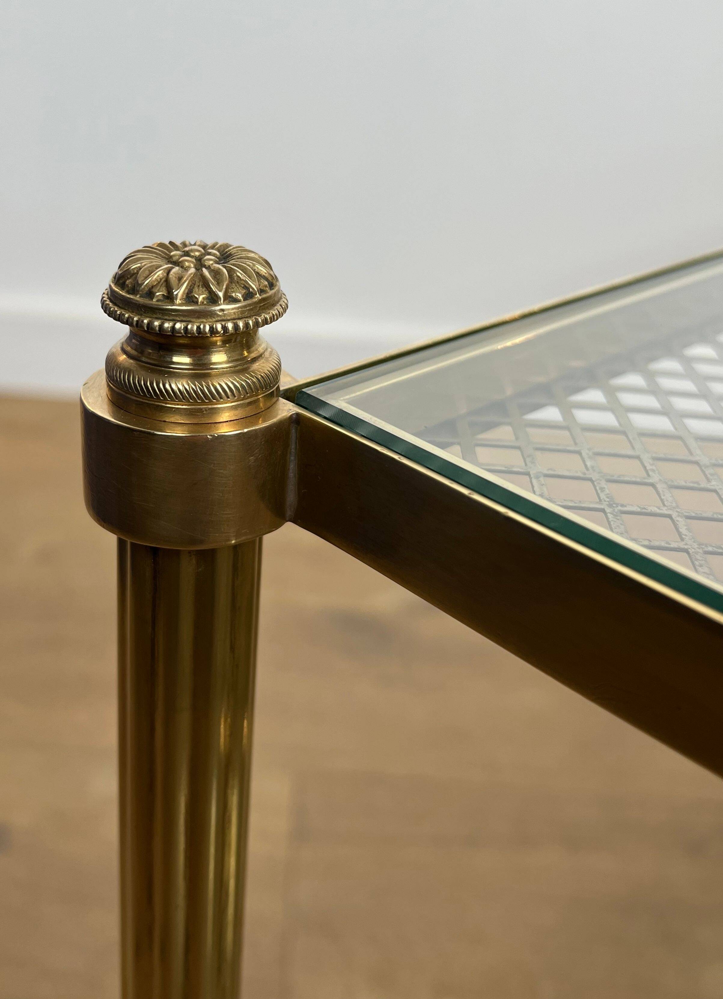 Rare bronze, brass, and steel mesh coffee table with a double glass top resting on a brass mesh. French work by Jansen