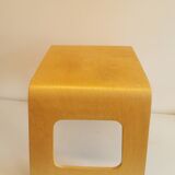 Design stool/side table made of curved plywood.