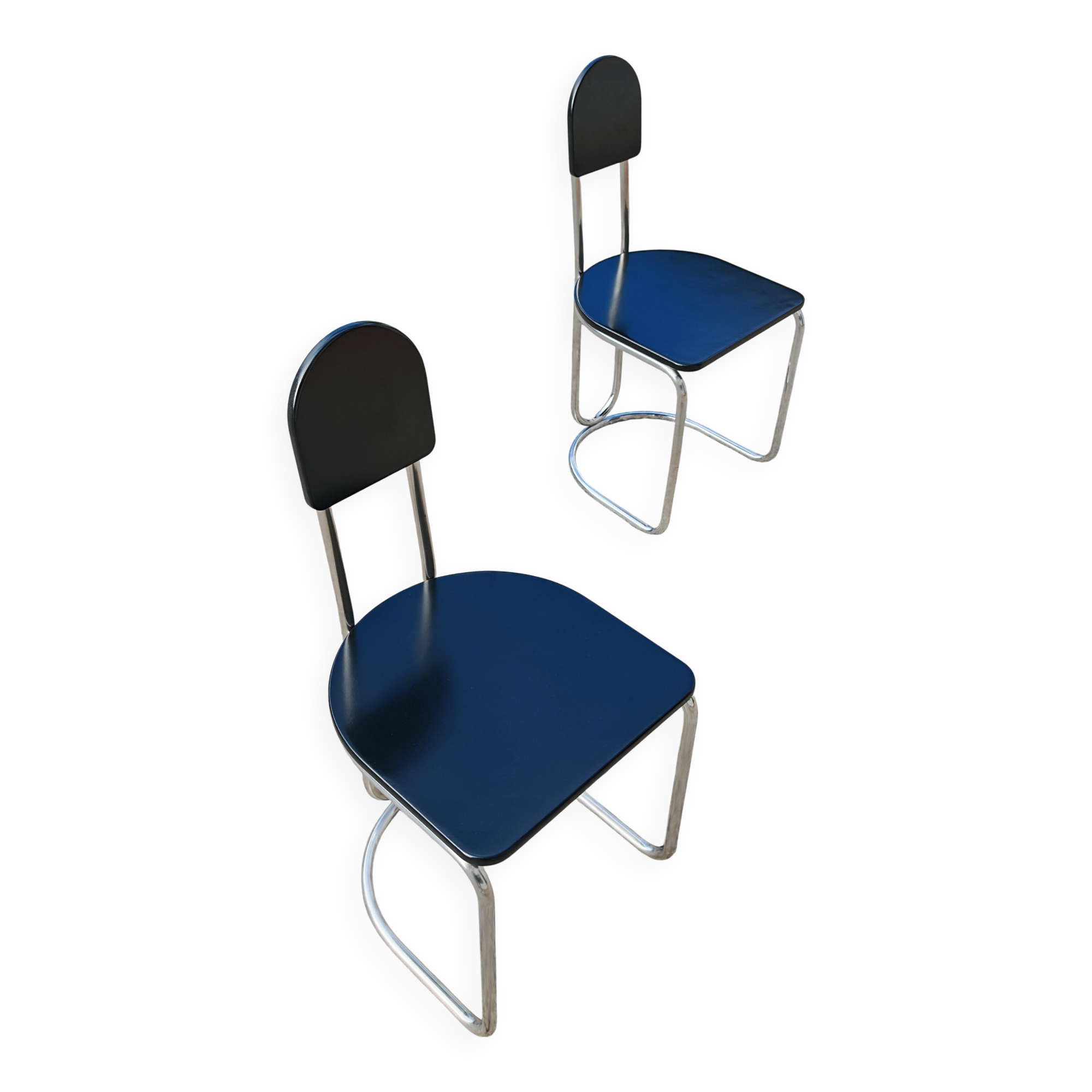 Set of 4 Bauhaus tubular steel chairs with wooden seats.