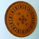 Round top in carved wood and vintage varnish