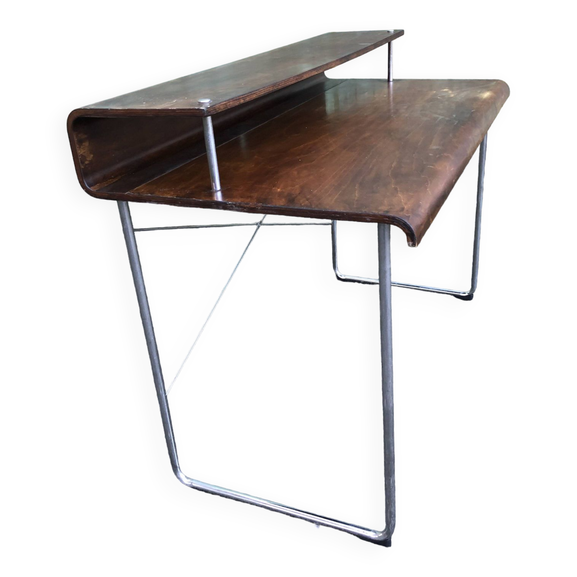 Design desk in formed glued laminated wood with chrome tubular base.