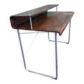 Design desk in formed glued laminated wood with chrome tubular base.