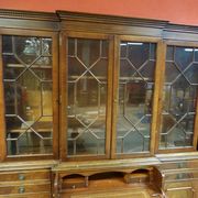 Scribanne bookcase in mahogany veneer English work of the twentieth century