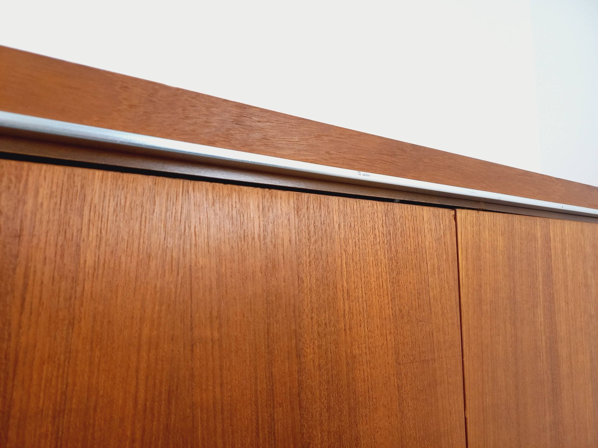 Vintage Scandinavian modernist wardrobe in teak and metal from the 1960s.