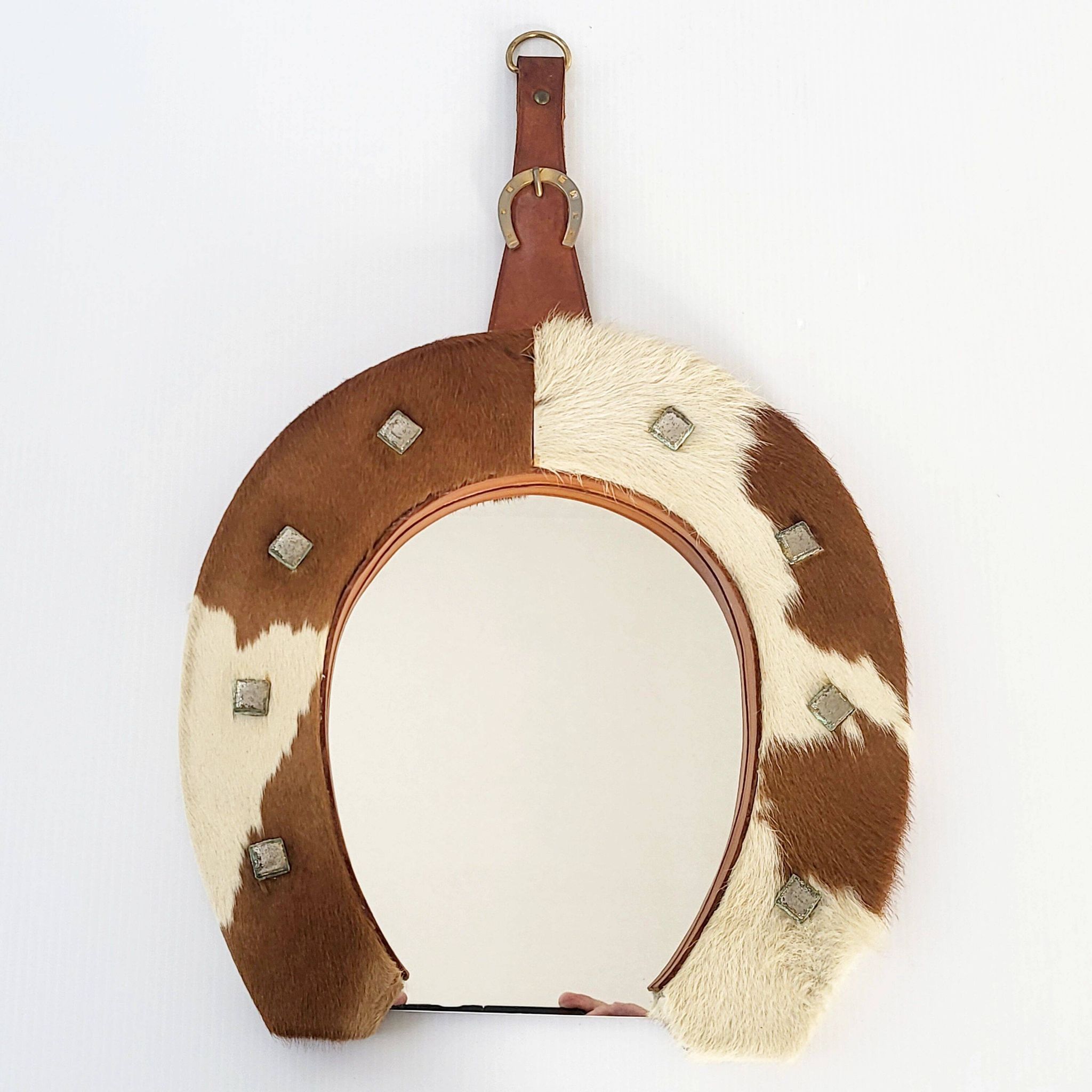 Vintage 1970s cowhide horseshoe mirror