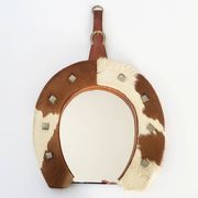 Vintage 1970s cowhide horseshoe mirror