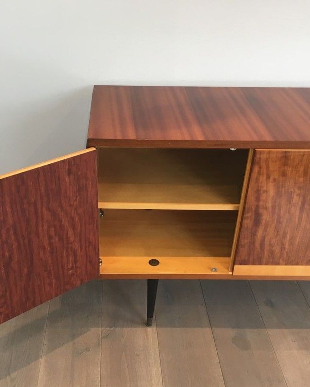 Mahogany enfilade on a blackened wooden base