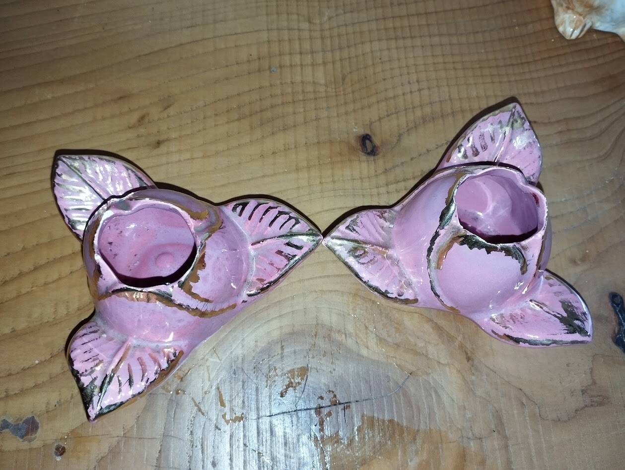 A pair of pink earthenware candlesticks (1940s–50s)