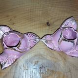 A pair of pink earthenware candlesticks (1940s–50s)