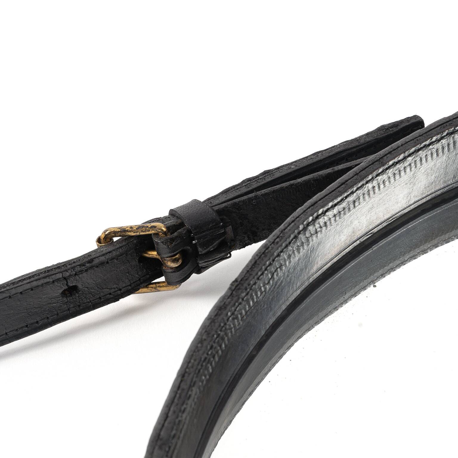 Leather strap mirror attributed to Jacques Adnet, France, 1960s.